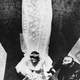 Seen from above are the Royal newly-weds, British Princess Elizabeth and Lieutenant Philip Mountbatten (Duke of Edinburgh) as they leave Westminster Abbey, London, November 20, 1947. After their marriage, shows the bridal train. The 15-foot long bridal train is of transparent ivory silk, attached to the shoulders and edged with graduated satin flowers, finally forming a deep border encrusted with pearls and crystals. (AP Photo)